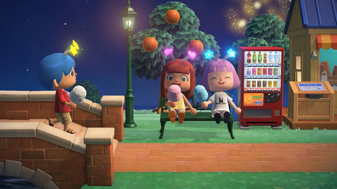 Three Animal Crossing players at night: two sit on a park bench eating cotton candy while a third walks up stone steps toward them, with fireworks in the sky.