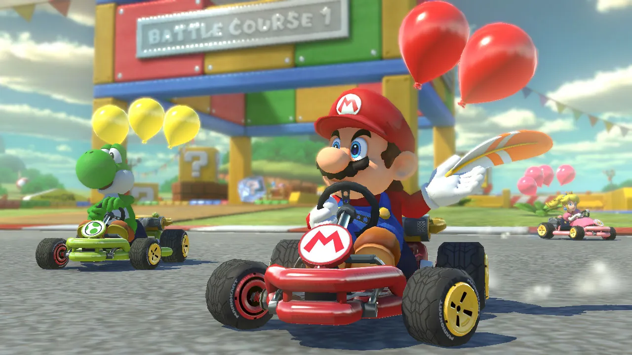 Mario in his red kart on Battle Course 1, holding a feather with balloons tied to the kart, as Yoshi and Peach drive behind him.